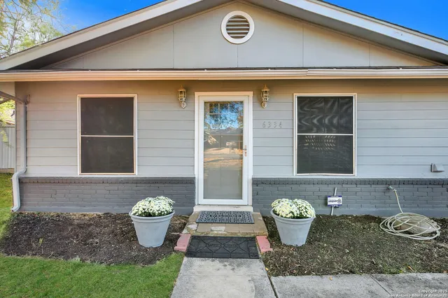a front view of a house with patio