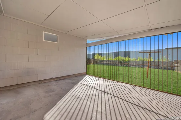 a view of backyard with green space