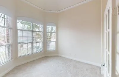 a view of an empty room with a window