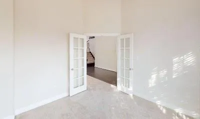 a view of a room with white walls