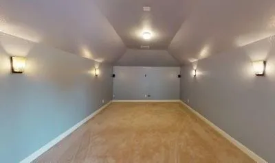 an empty room with a empty space and windows