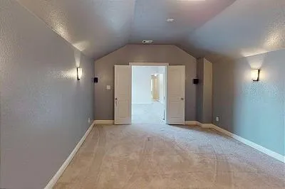 a bathroom with a tub sink shower and mirror