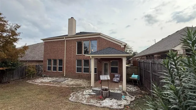 a front view of a house with a yard garage and outdoor seating