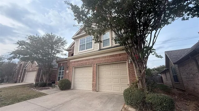 front view of a house with a trees