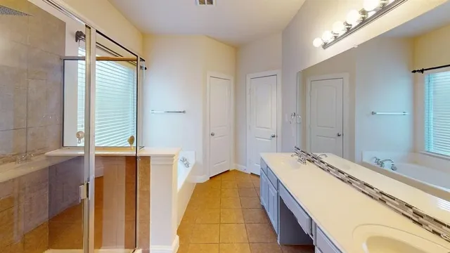 a bathroom with a tub and a sink