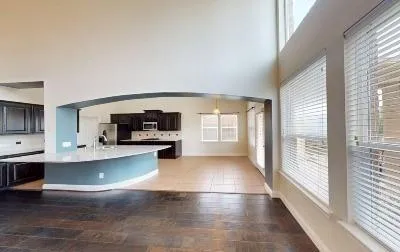 a view of a living room with furniture and a fireplace