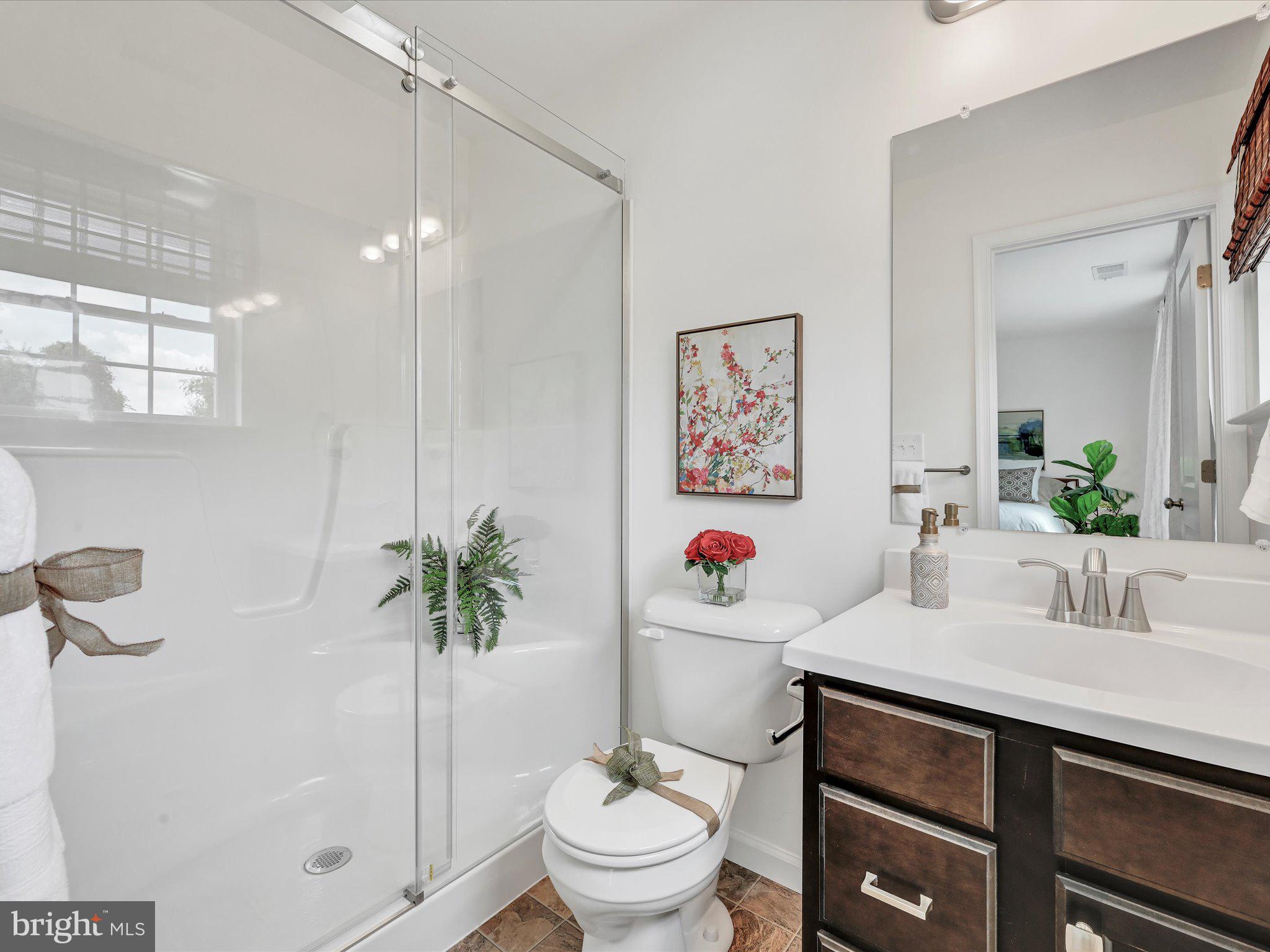 123 Holstein Drive, Unit 161 Hanover, PA 17331 - Photo 16 of 18 a bathroom with a sink toilet and a mirror