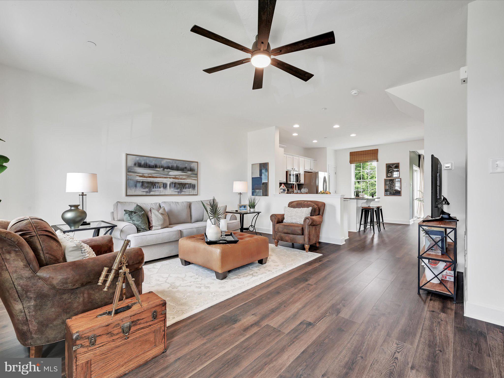 123 Holstein Drive, Unit 161 Hanover, PA 17331 - Photo 3 of 18 a living room with furniture or wooden floor and a ceiling fan