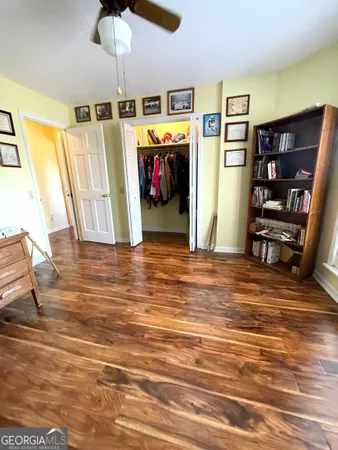 a view of a livingroom with furniture and staircase