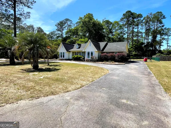 a house with trees in the background