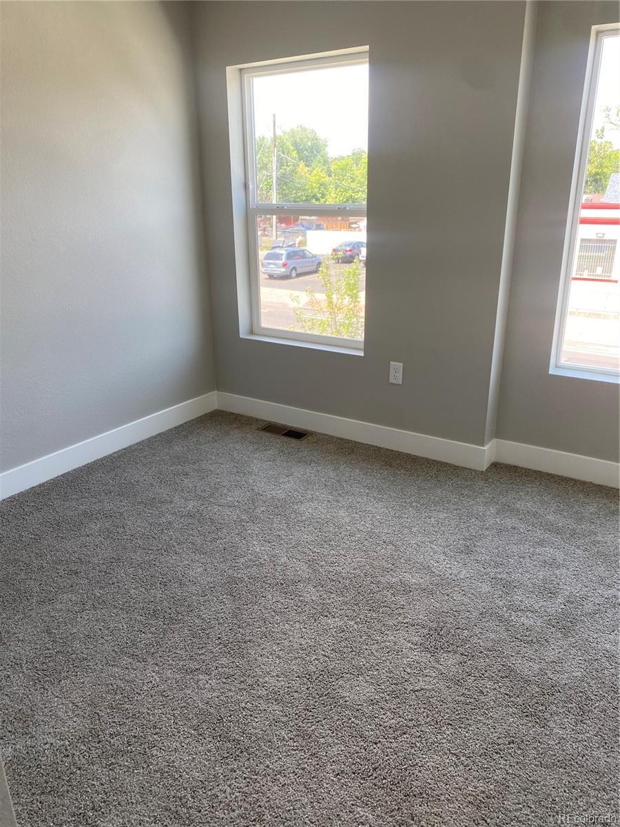 81 North Meade Denver, CO 80219 - Photo 11 of 19 an empty room with a window
