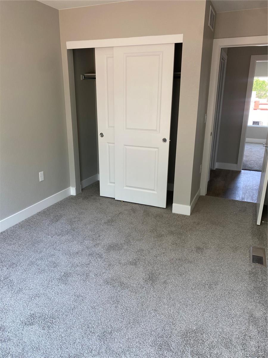 81 North Meade Denver, CO 80219 - Photo 13 of 19 an empty room with windows