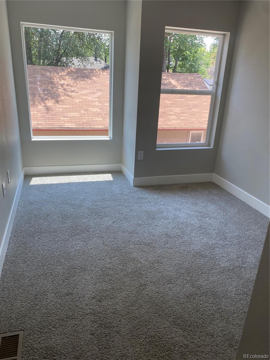 81 North Meade Denver, CO 80219 - Photo 14 of 19 an empty room with a window