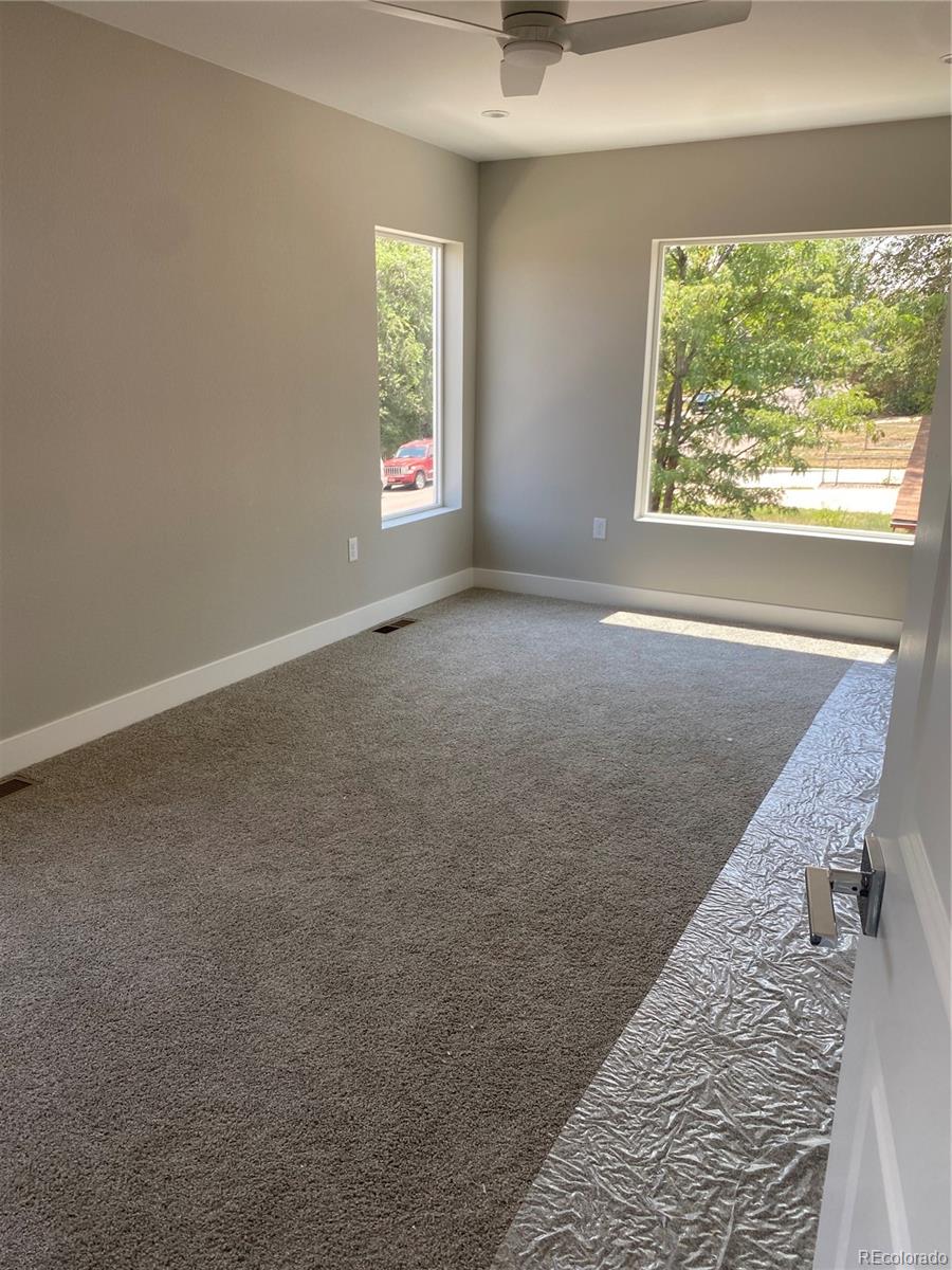 81 North Meade Denver, CO 80219 - Photo 10 of 19 an empty room with windows