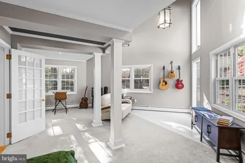 a spacious bedroom with a large bed and a couch