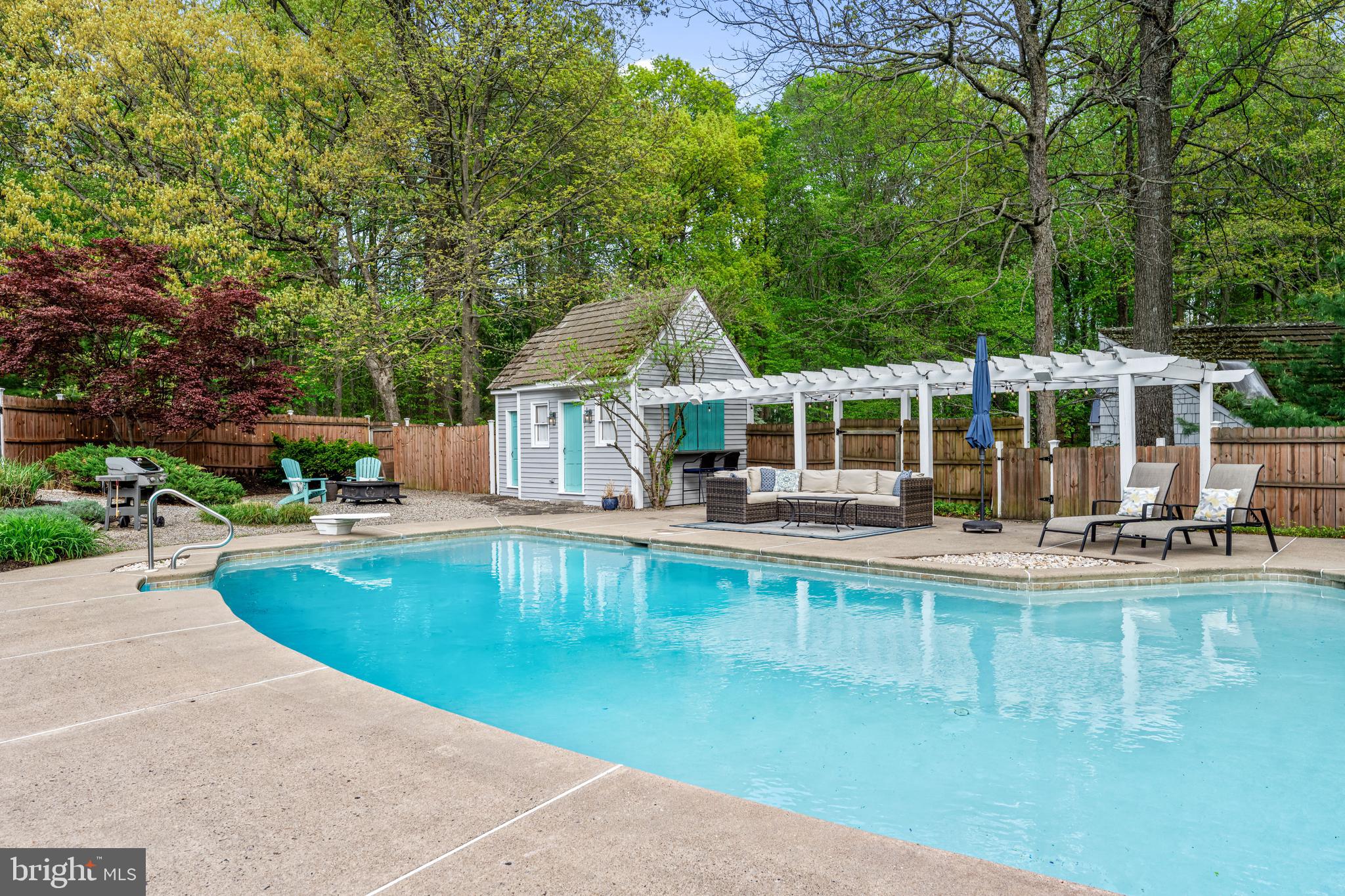 2959 Burnt House Hill Road Doylestown, PA 18902 - Photo 4 of 63 swimming pool view with a seating space and a garden view