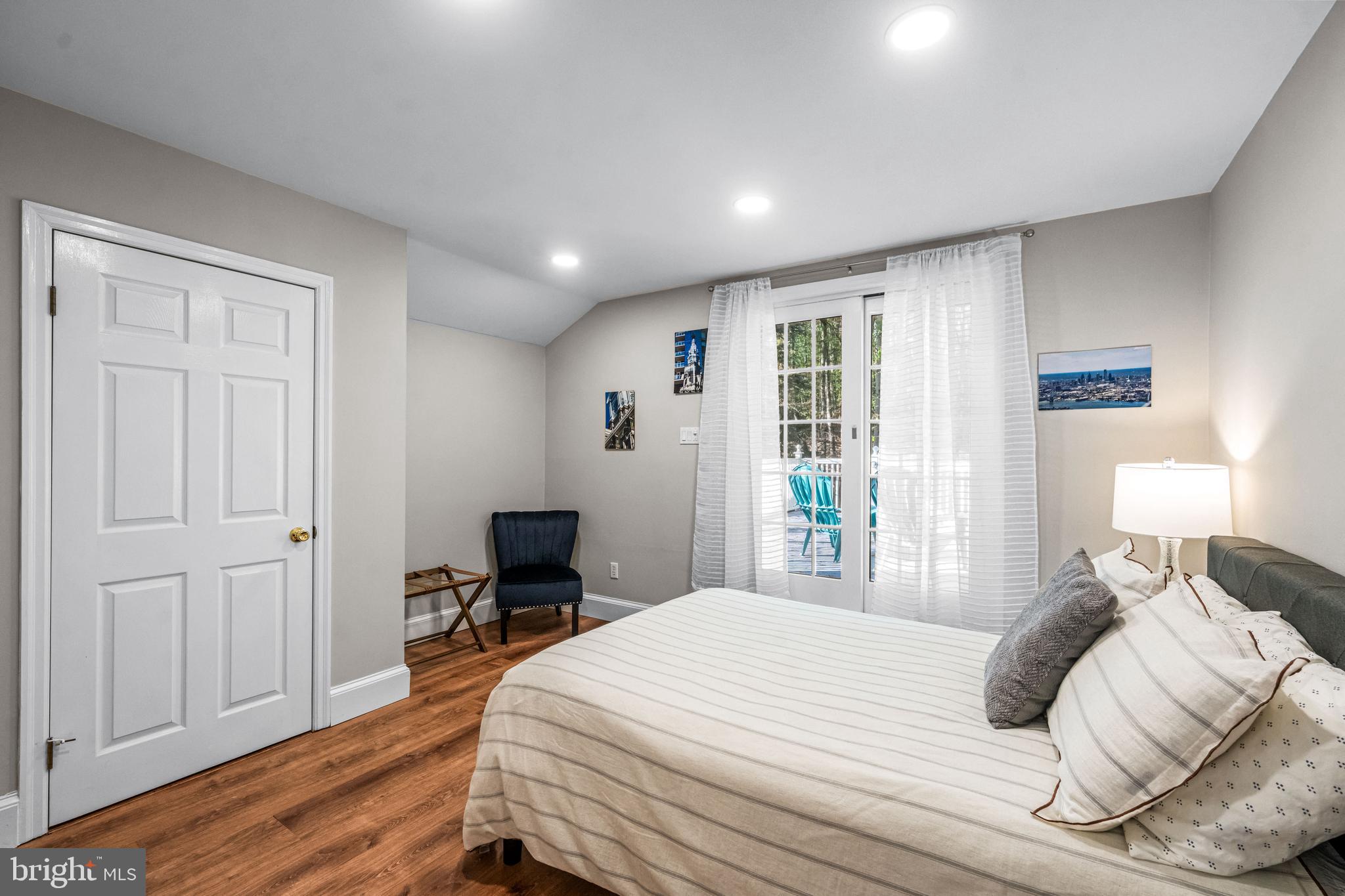 2959 Burnt House Hill Road Doylestown, PA 18902 - Photo 44 of 63 a bedroom with a bed and wooden floor