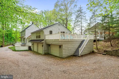 a backyard of a house with barbeque oven