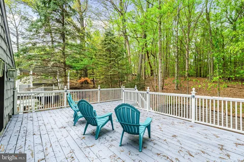 a view of a chairs and table in the patio