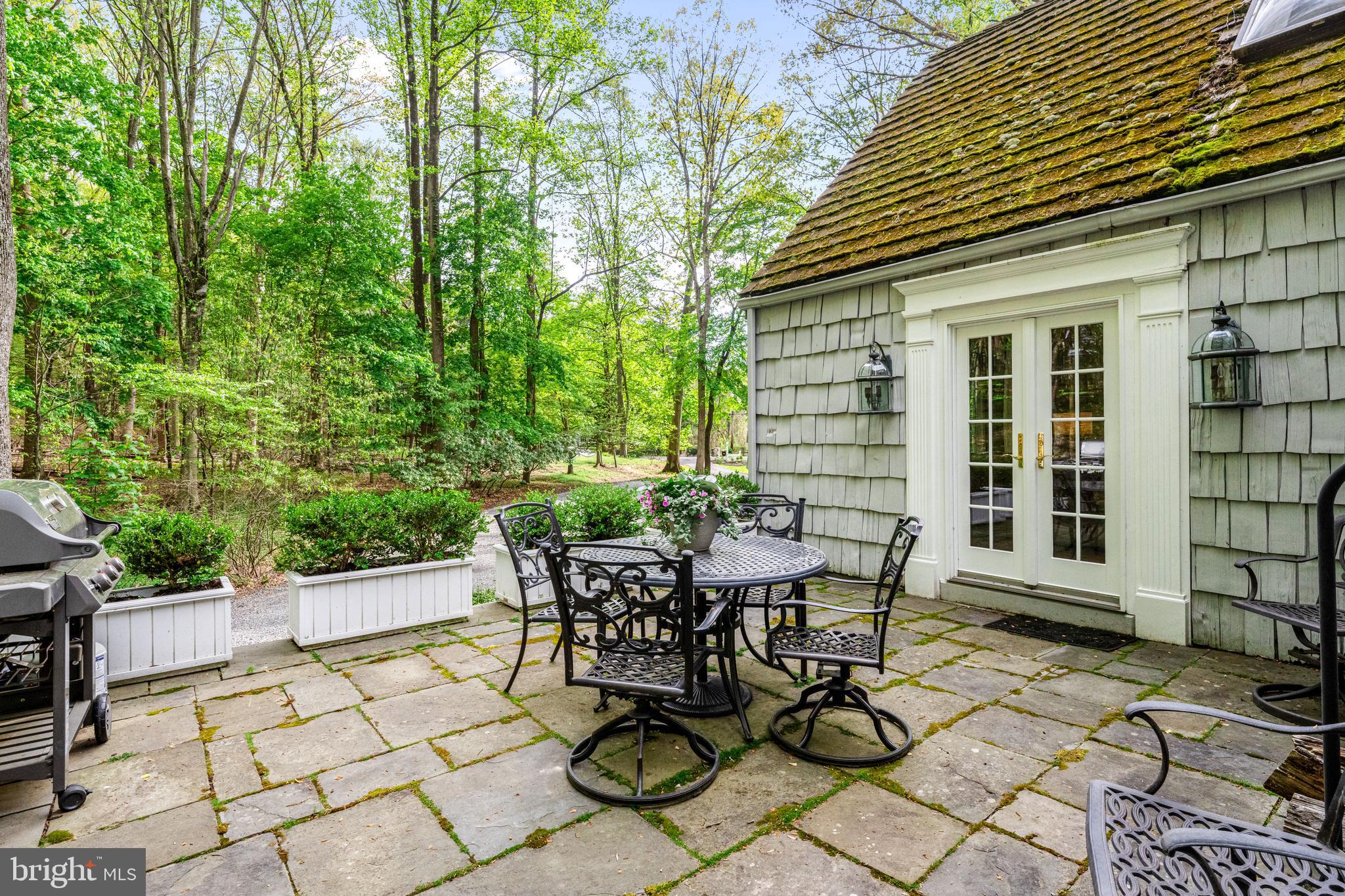 2959 Burnt House Hill Road Doylestown, PA 18902 - Photo 49 of 63 a view of a patio with table and chairs and potted plants