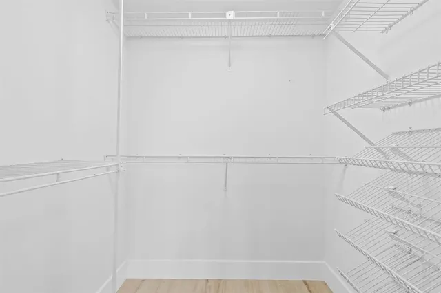 a living room with a couch and a table with rug