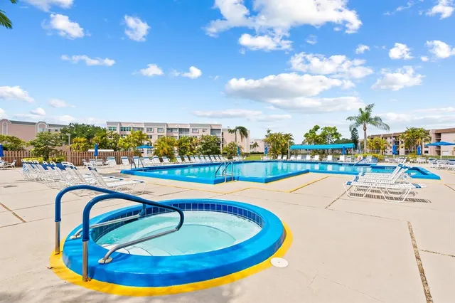 a very nice looking living room with stainless steel appliances