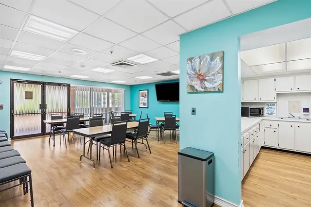 a view of a dining area with furniture and wooden floor