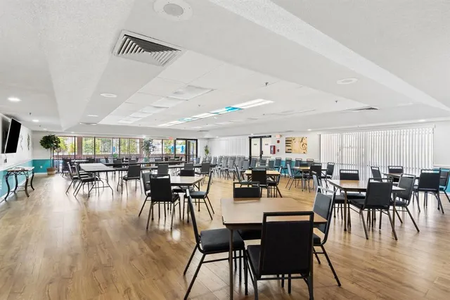 a view of a room with furniture and window