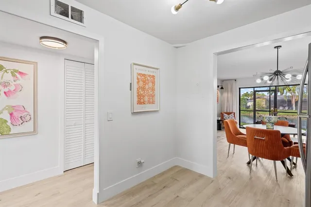 a bathroom with a sink vanity mirror and toilet