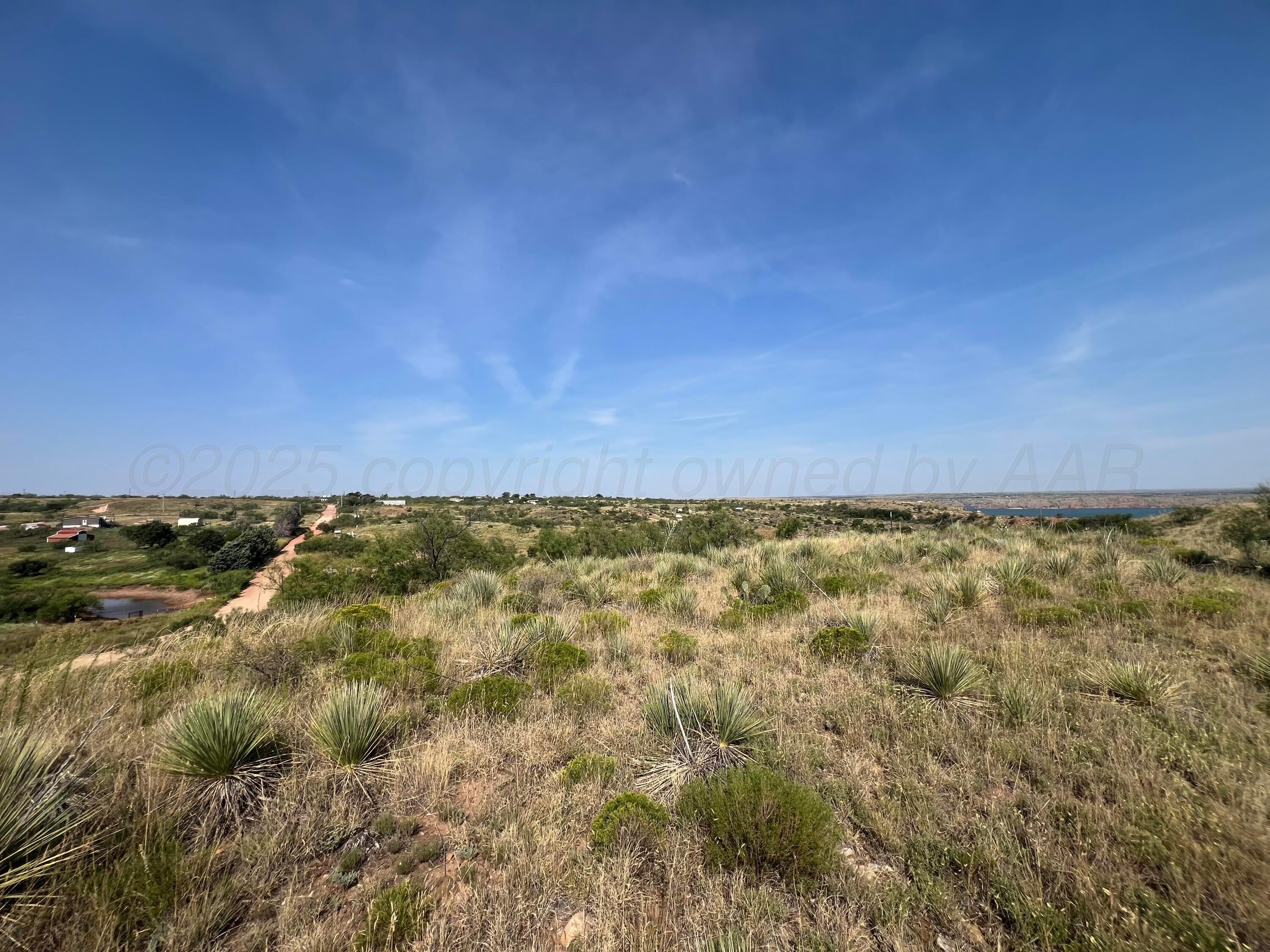 9831 Amarillo Road Fritch, TX 79036 - Photo 6 of 17 a view of an outdoor space and a lake view