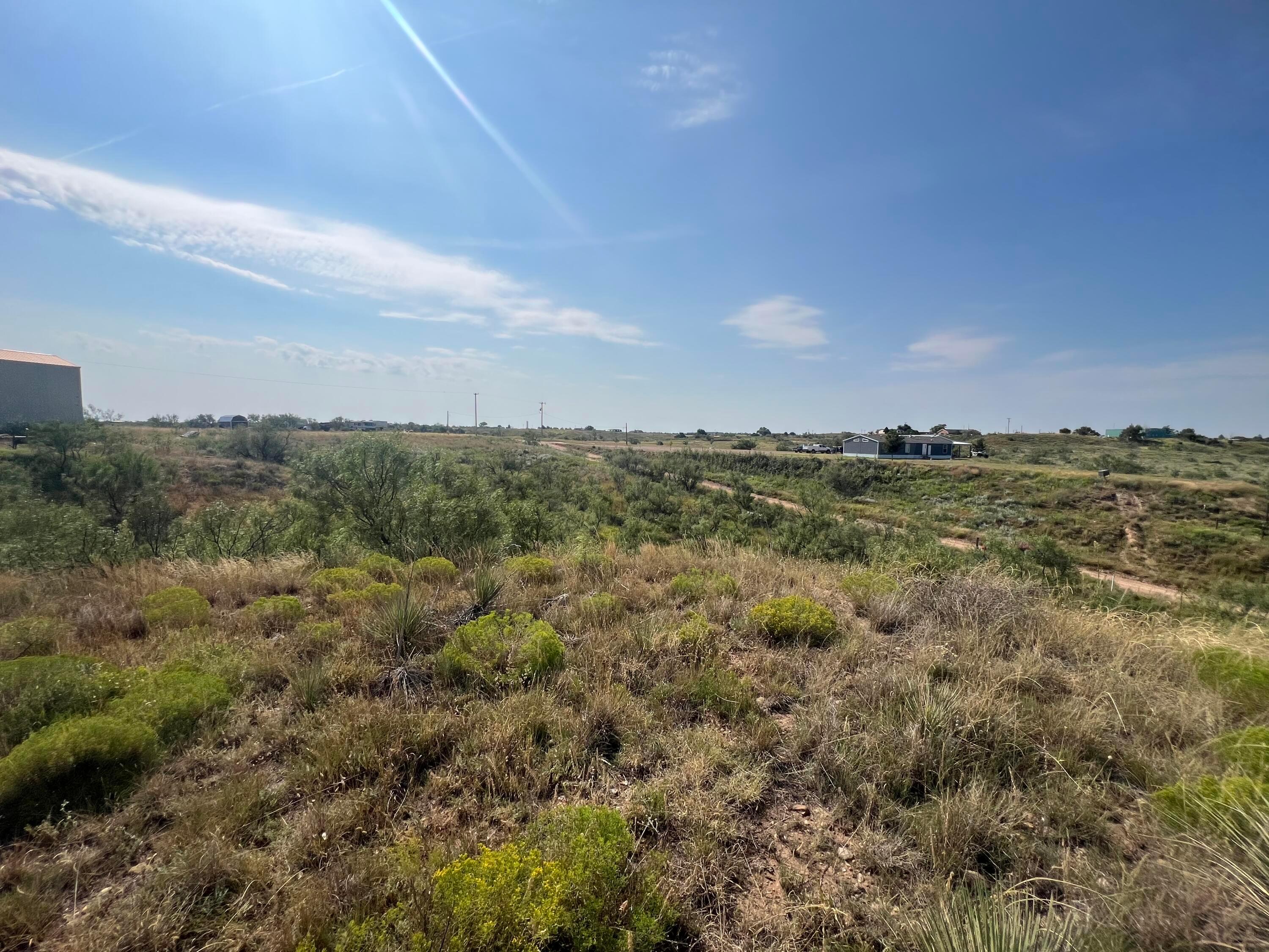 9831 Amarillo Road Fritch, TX 79036 - Photo 7 of 17 a view of a city with lots of trees