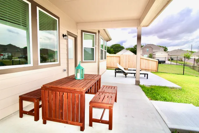 a view of a patio with a table chairs and a patio