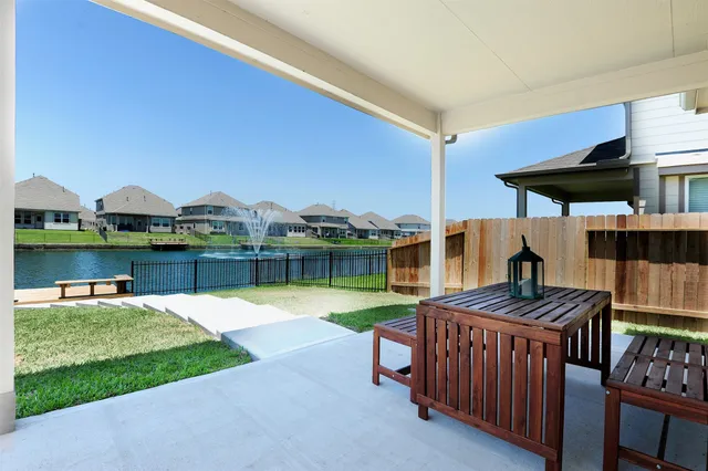 a view of a backyard with sitting area