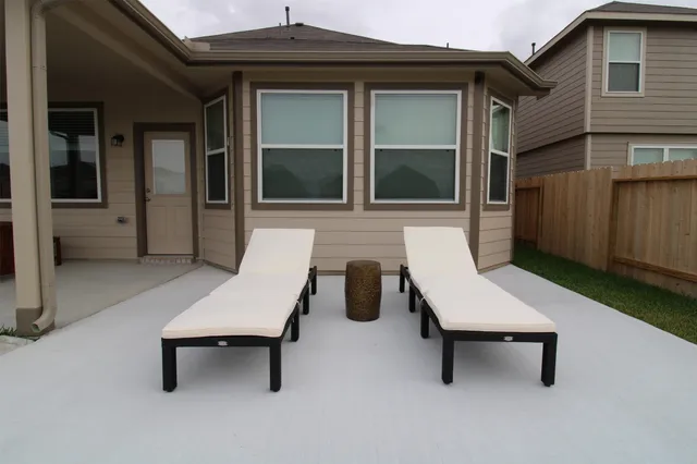 a view of a lounge chairs in the patio