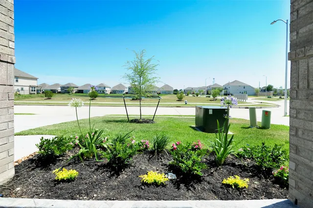 a view of a garden with a lake
