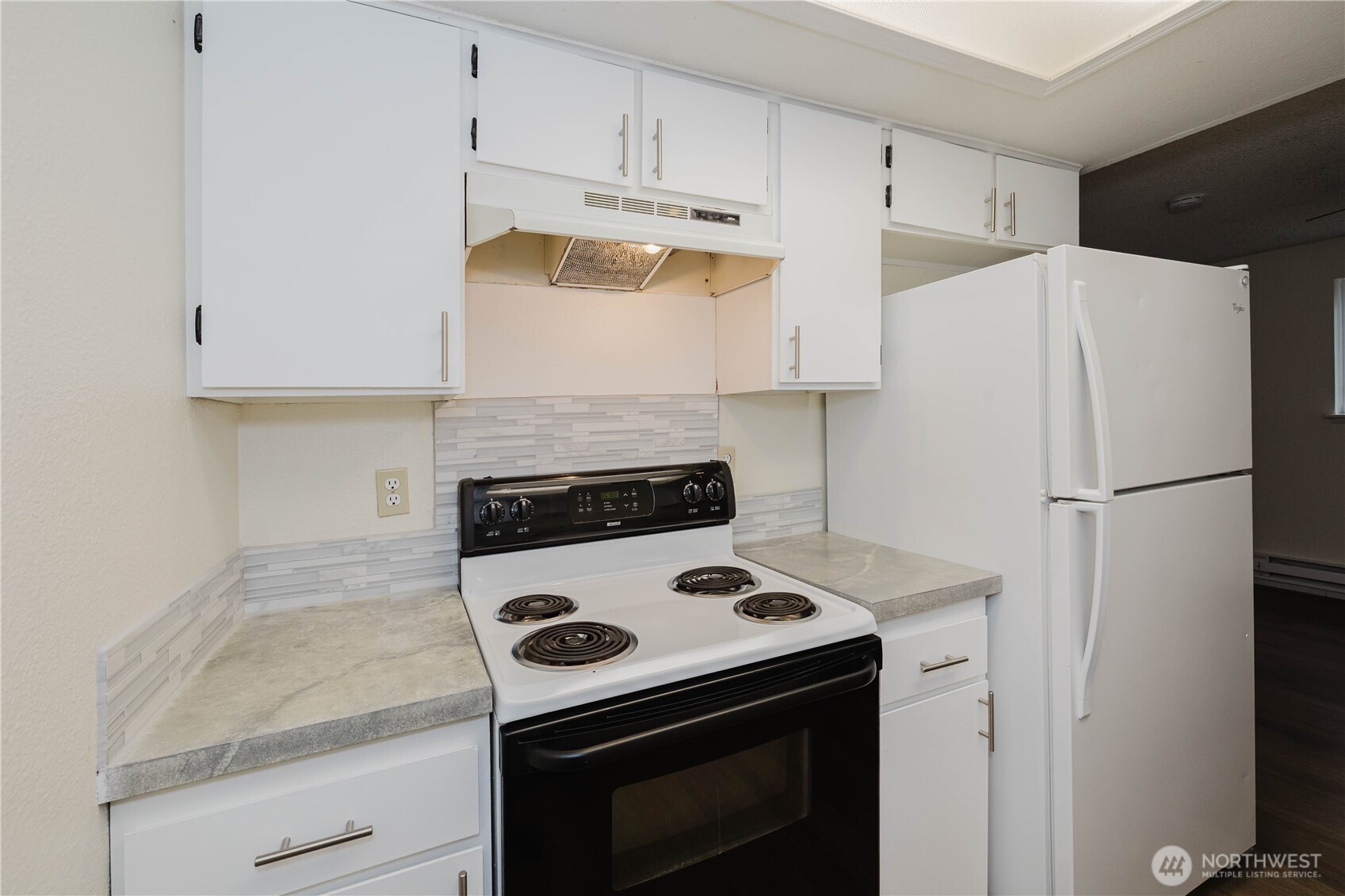 70 East Huckleberry Drive Grapeview, WA 98546 - Photo 12 of 25 a kitchen with a stove and a refrigerator