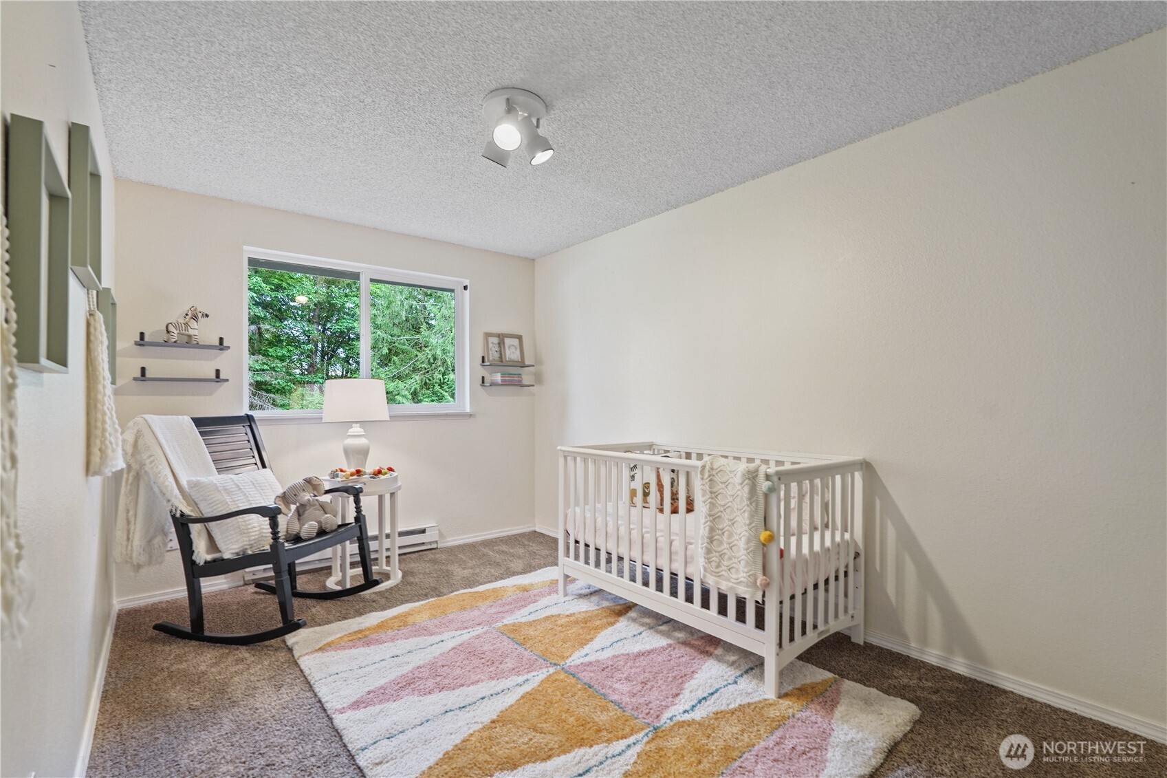 70 East Huckleberry Drive Grapeview, WA 98546 - Photo 18 of 25 a view of a bedroom with furniture and a window