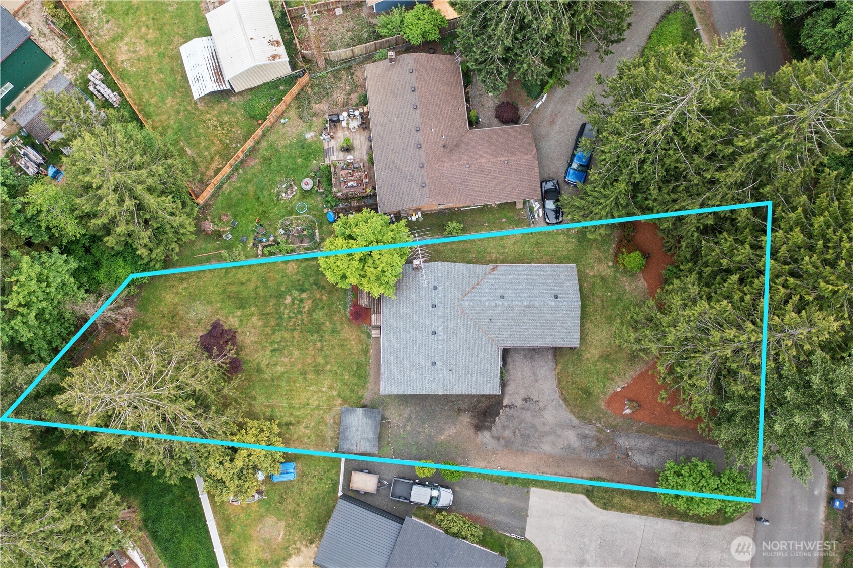 70 East Huckleberry Drive Grapeview, WA 98546 - Photo 2 of 25 an aerial view of a house with a garden