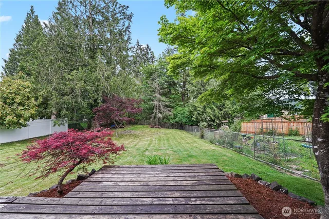 a view of a backyard with sitting area