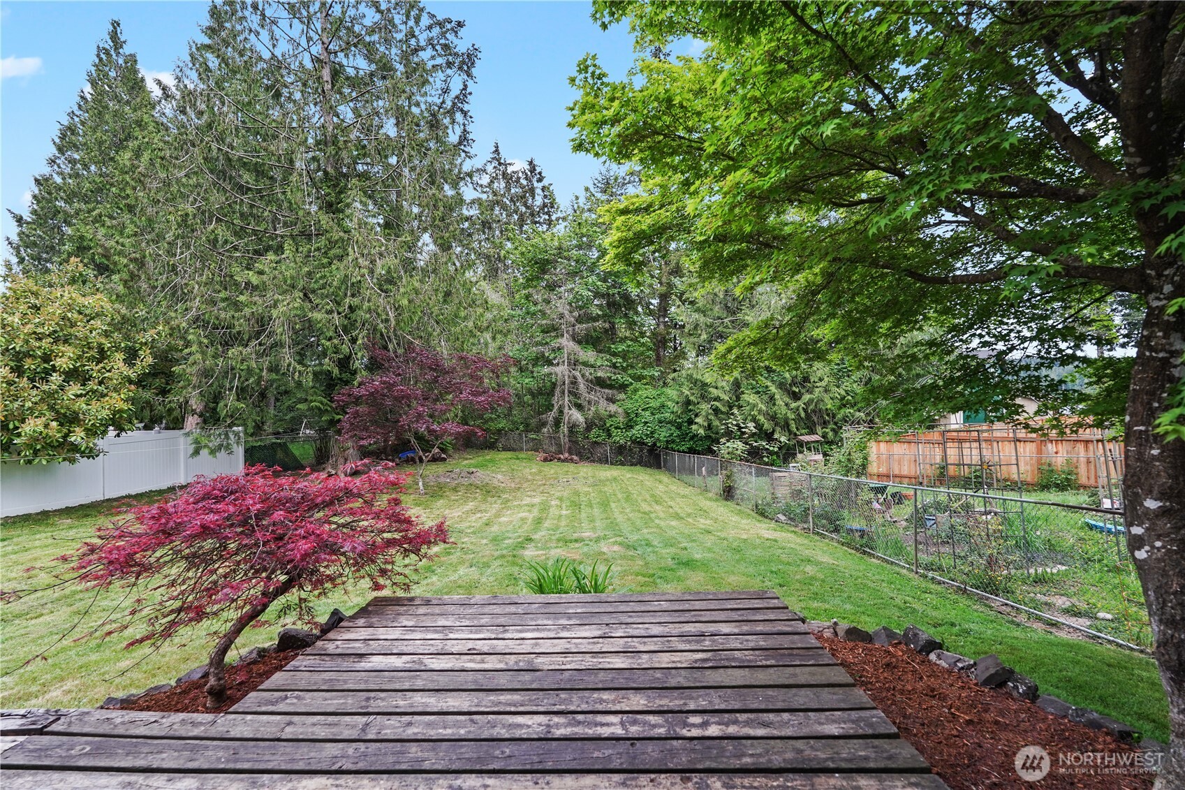70 East Huckleberry Drive Grapeview, WA 98546 - Photo 22 of 25 a view of a backyard with a garden