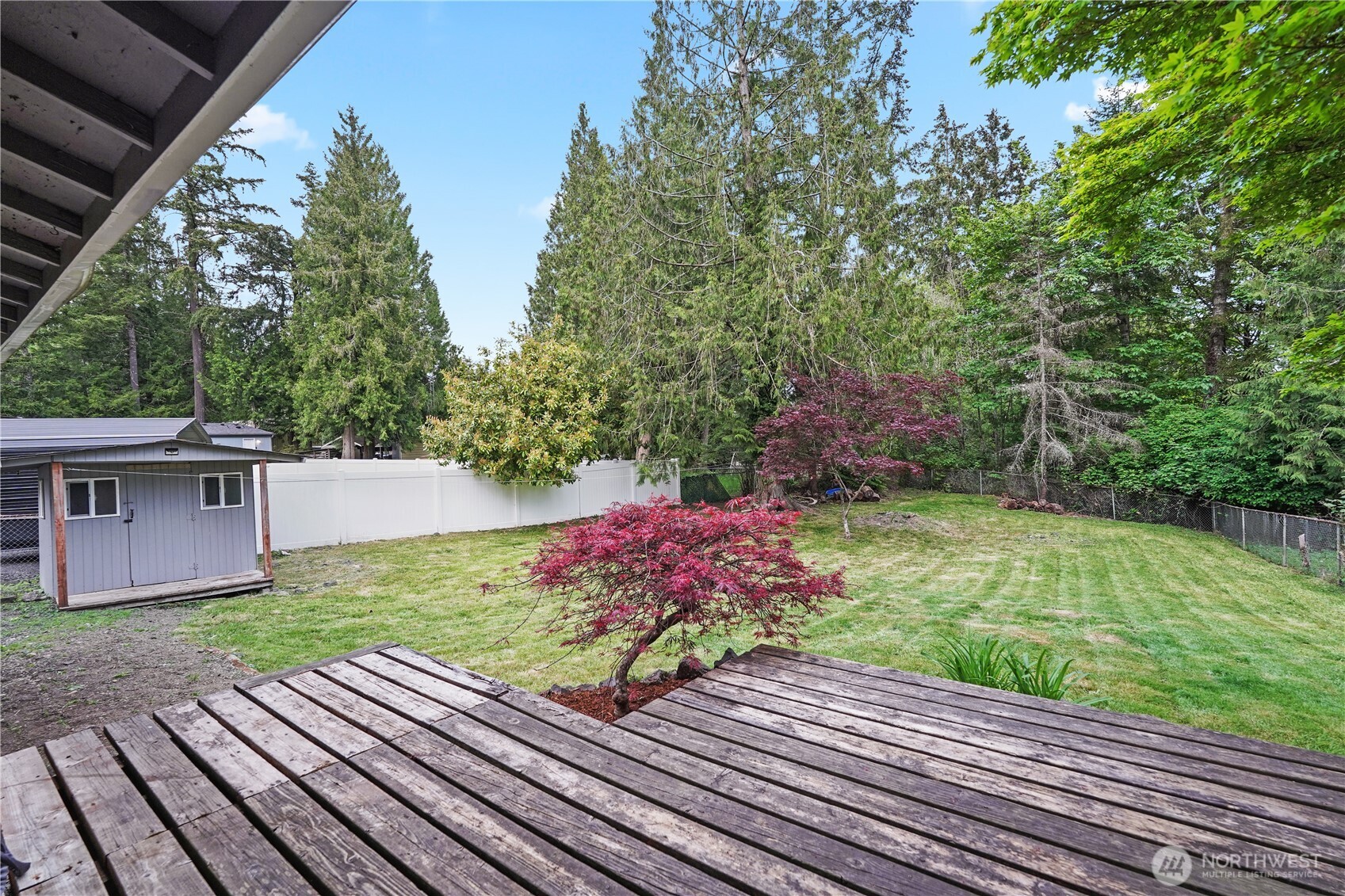 70 East Huckleberry Drive Grapeview, WA 98546 - Photo 23 of 25 a view of a backyard with sitting area