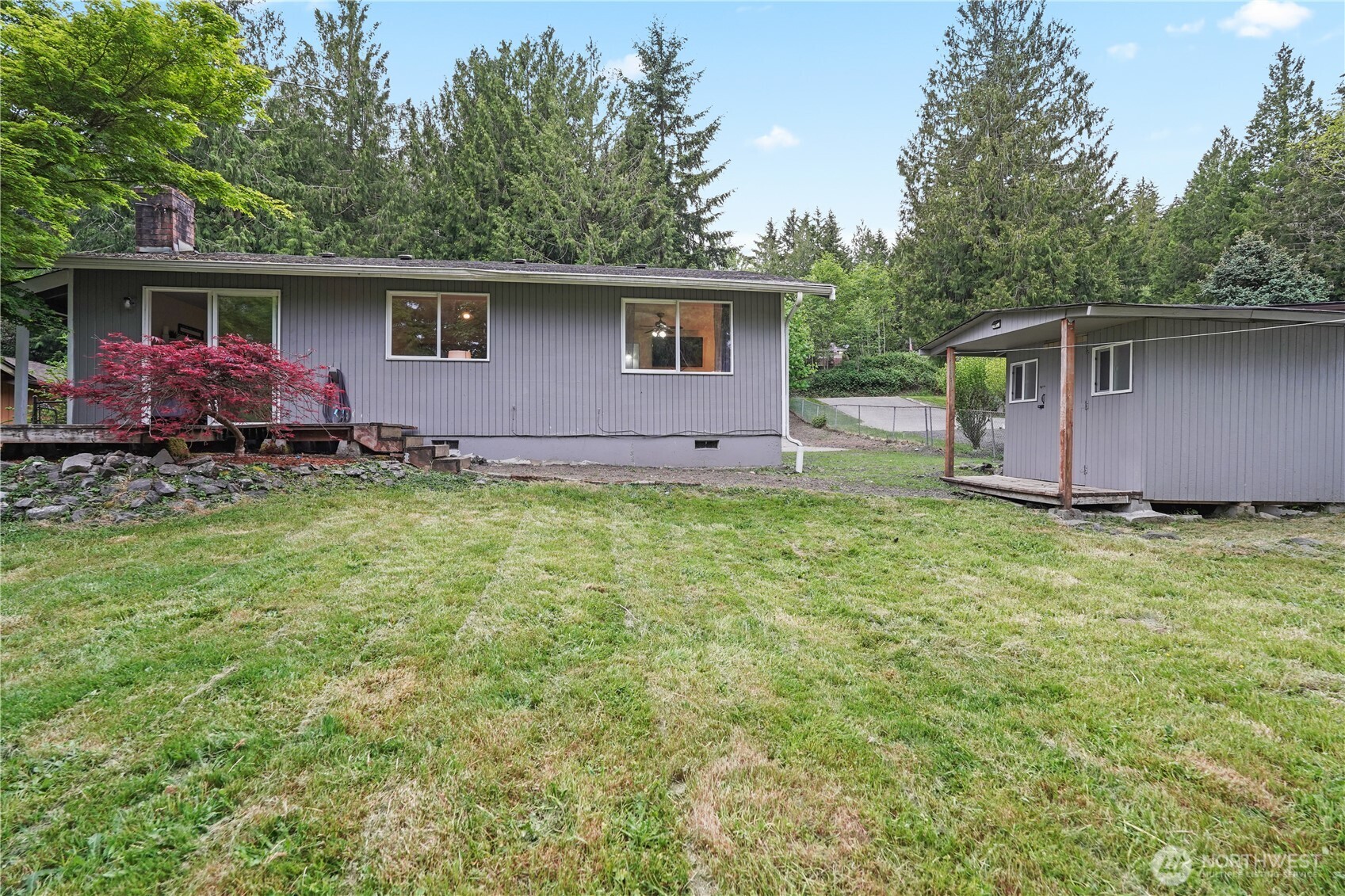 70 East Huckleberry Drive Grapeview, WA 98546 - Photo 24 of 25 a view of a house with a backyard