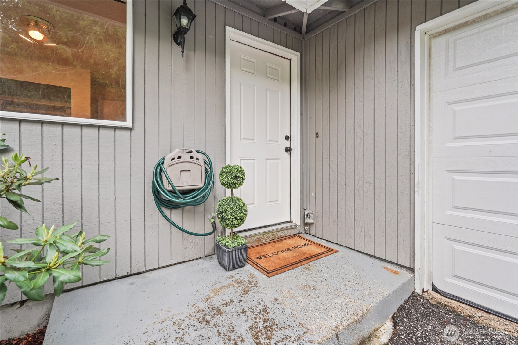 70 East Huckleberry Drive Grapeview, WA 98546 - Photo 3 of 25 a front view of a house with garden