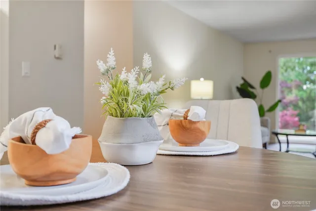a vase of flowers sitting on a table field