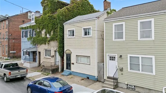 a car parked in front of a house