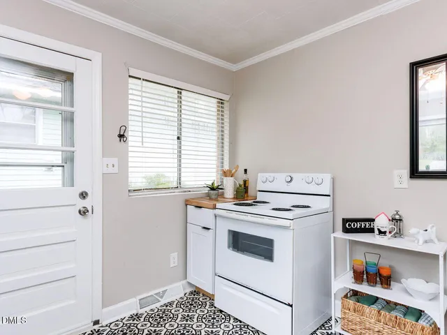 a view of a kitchen with a stove top oven