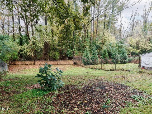 a view of a field with trees