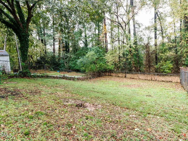 a view of outdoor space with deck and yard
