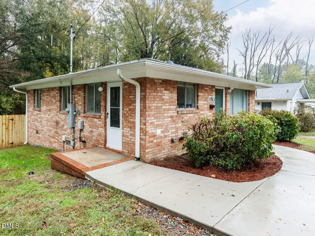 a front view of a house with yard
