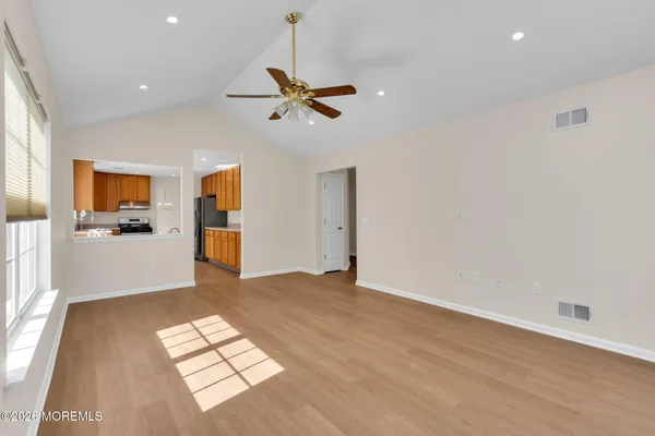 a view of livingroom with hardwood floor and a ceiling fan